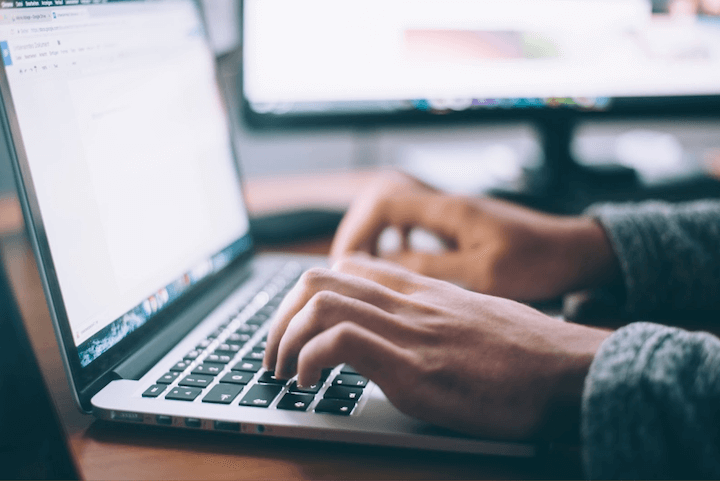 Man typing on a laptop